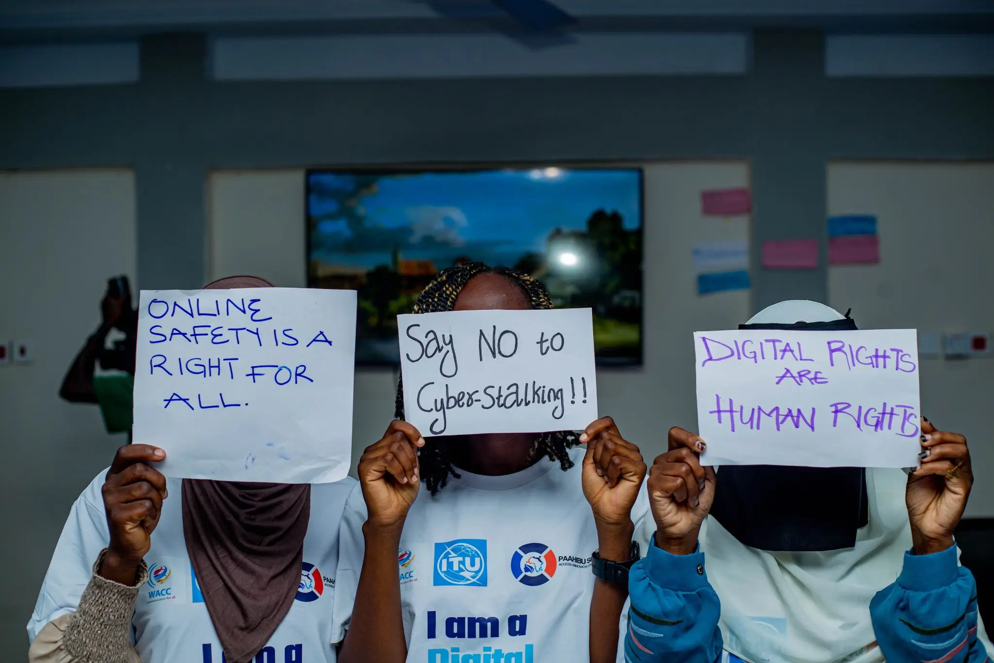 Students holding signs advocating for online safety and digital rights